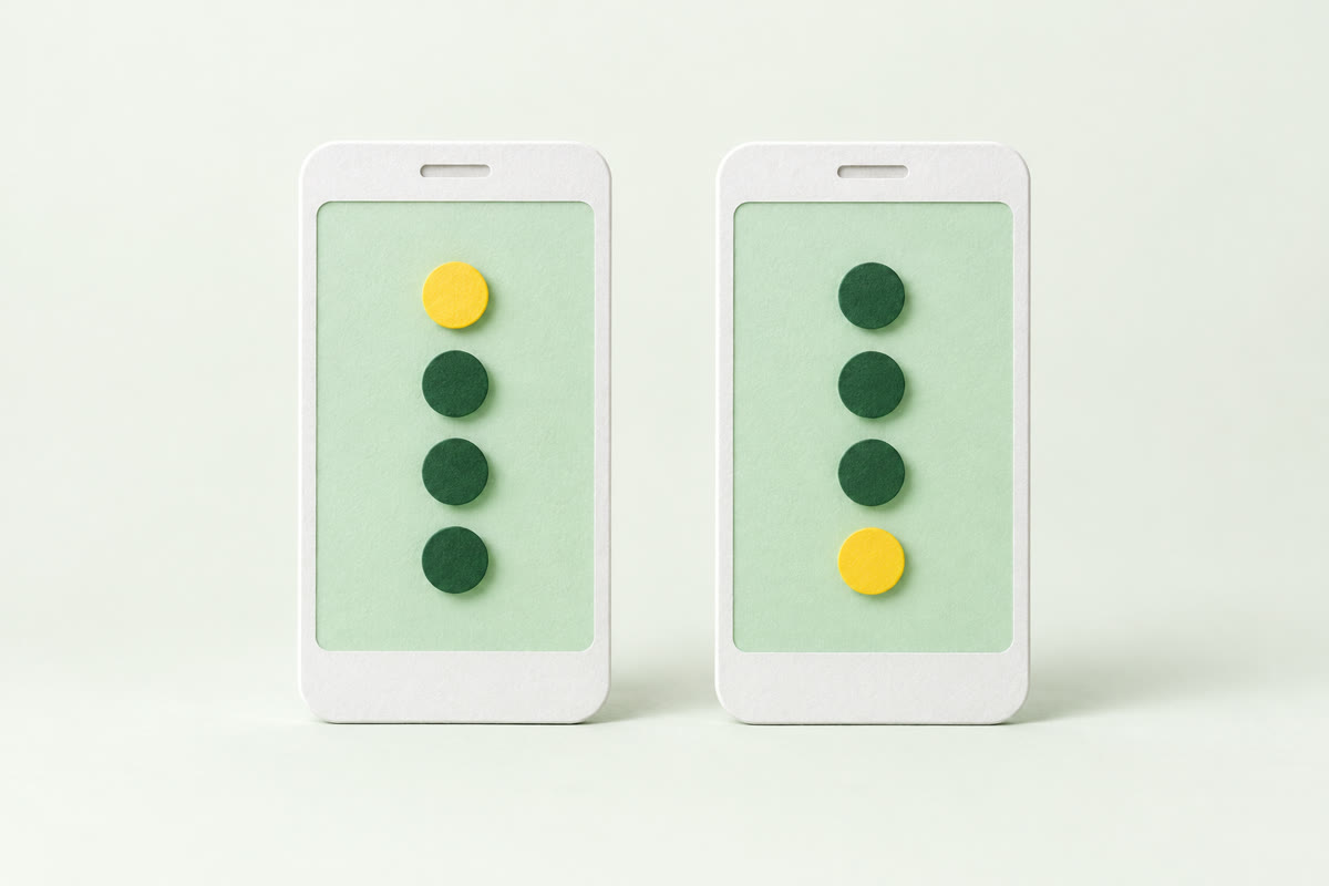 Illustration of two paper phones side by side, each with a column of four round pins, the yellow pin at the top on one and at the bottom on the other.